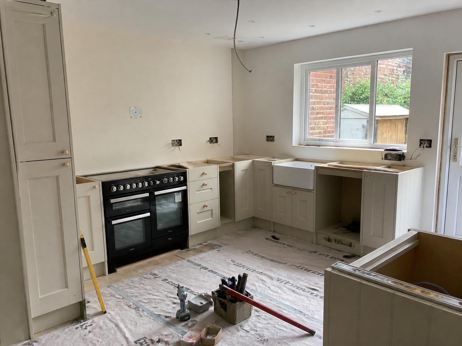 Fitted Shaker-style kitchen installation in progress inside a UK home — Ash Villa design & build